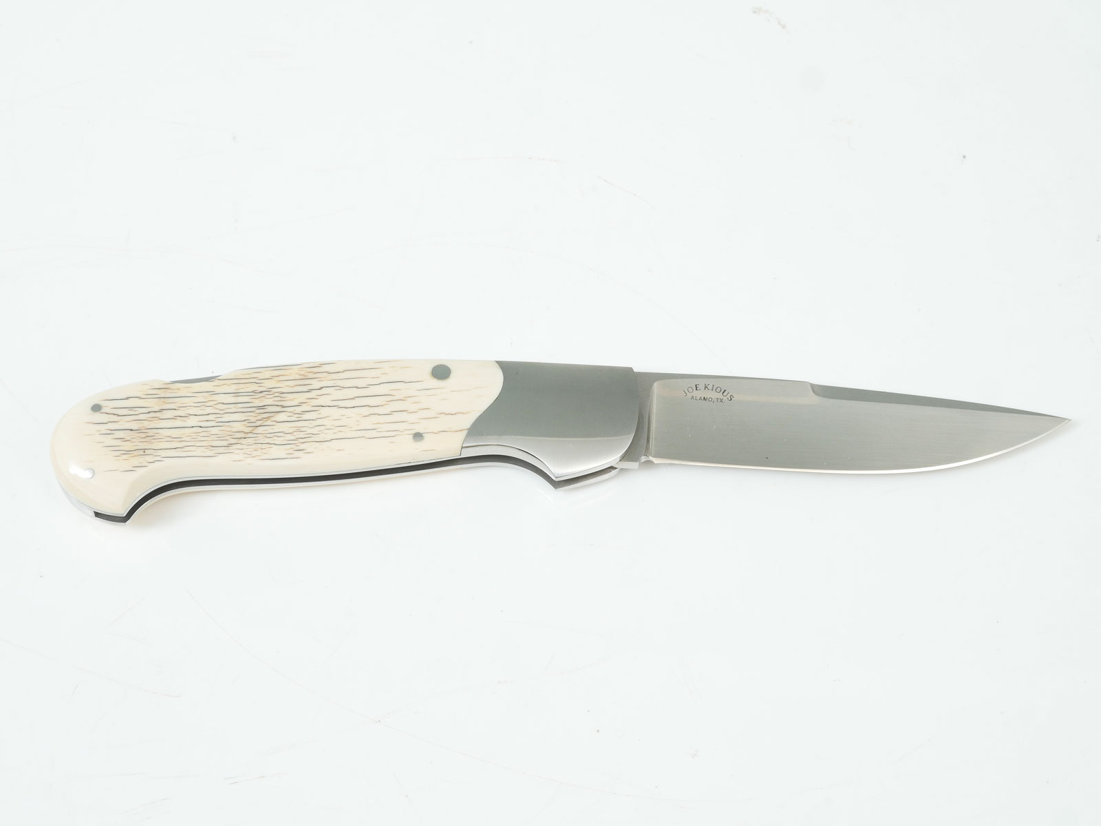 Appraisal: JOE KIOUS FOLDER BONE HANDLE Stainless steel frame with striated