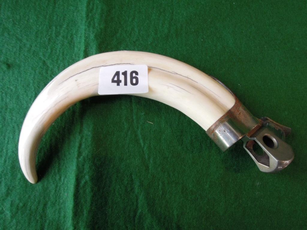 Appraisal: A cigar cutter with ivory tusk handle