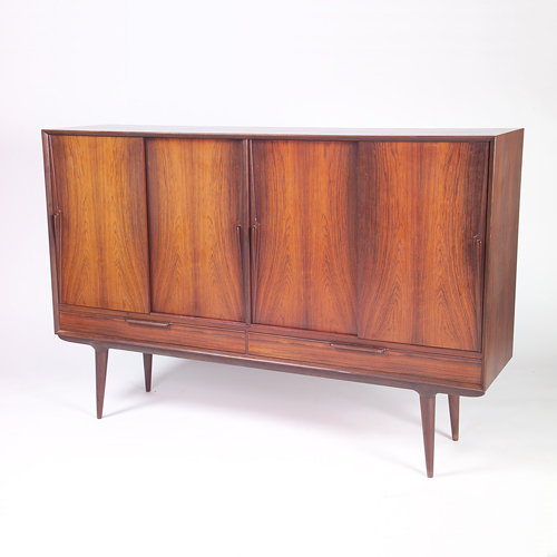 Appraisal: SCANDINAVIAN Fine rosewood buffet four sliding doors concealing three pull-out