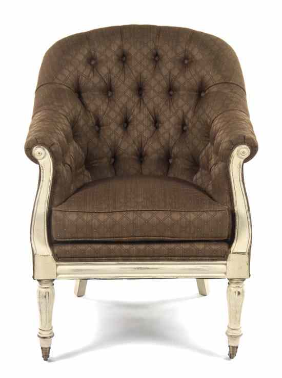 Appraisal: An American Upholstered Tub Chair having a button tufted back