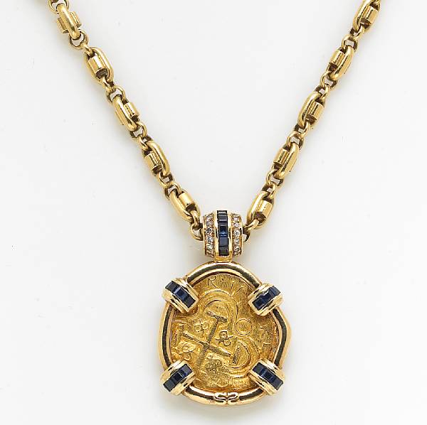 Appraisal: A sapphire diamond and high karat gold coin pendant with