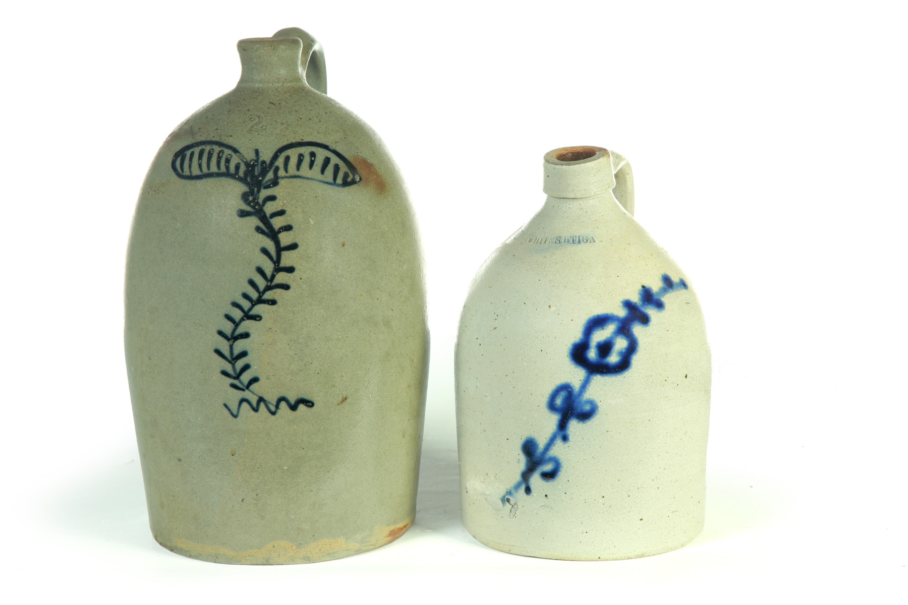 Appraisal: TWO STONEWARE JUGS American th quarter- th century Cobalt decoration