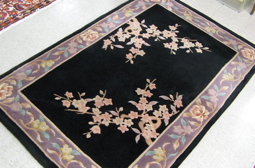 Appraisal: HAND KNOTTED CHINESE AREA RUG two prunus sprigs on plain