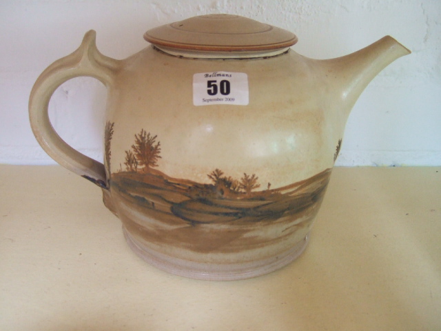 Appraisal: A stoneware teapot th century decorated with a landscape scene