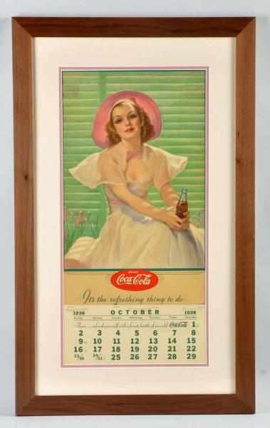 Appraisal: Coca-Cola Calendar Framed and matted under glass Retains metal strip