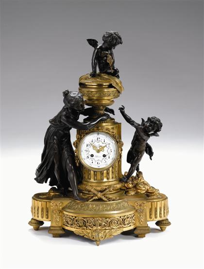 Appraisal: Louis XVI style gilt and patinated bronze mantel clock circa