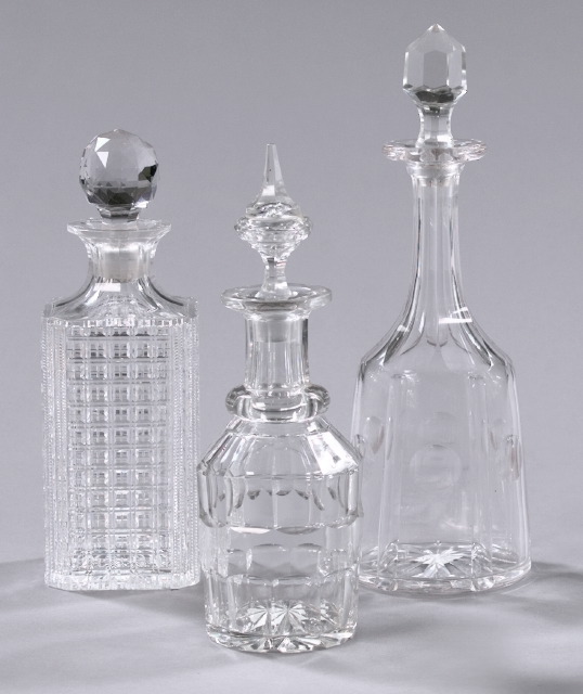 Appraisal: Group of Three Decanters consisting of an attractive English cut