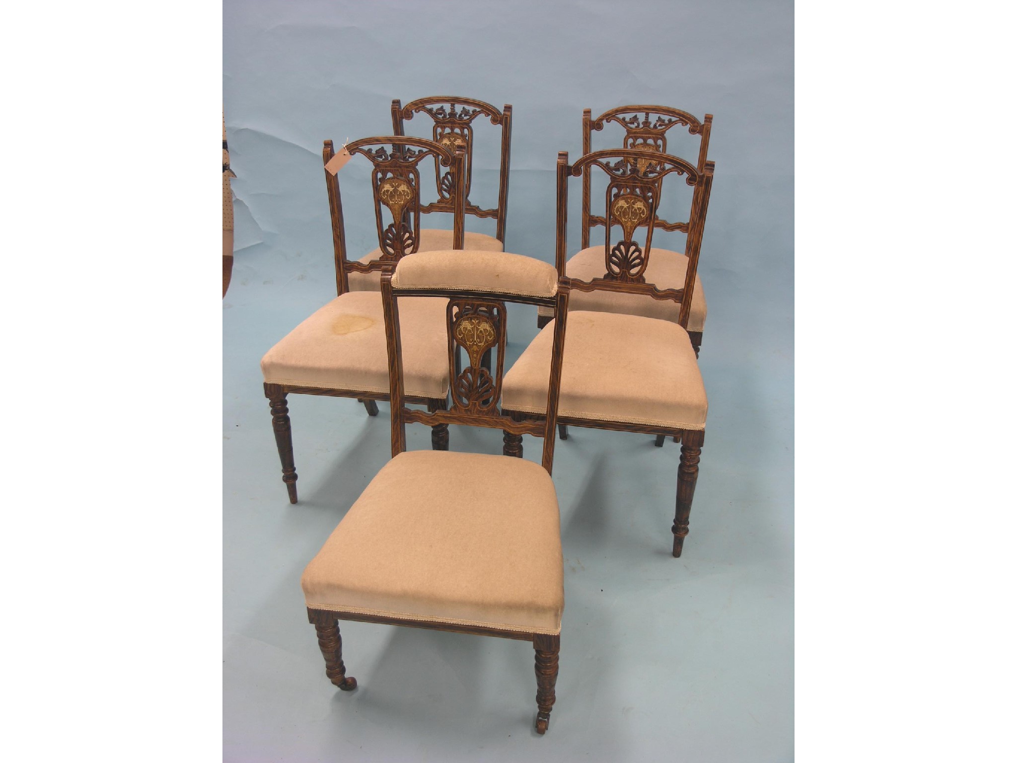 Appraisal: A set of four Edwardian rosewood and marquetry dining chairs