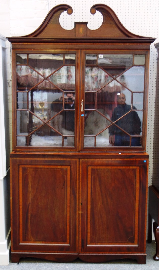 Appraisal: A George III style satinwood banded mahogany display cabinet cupboard