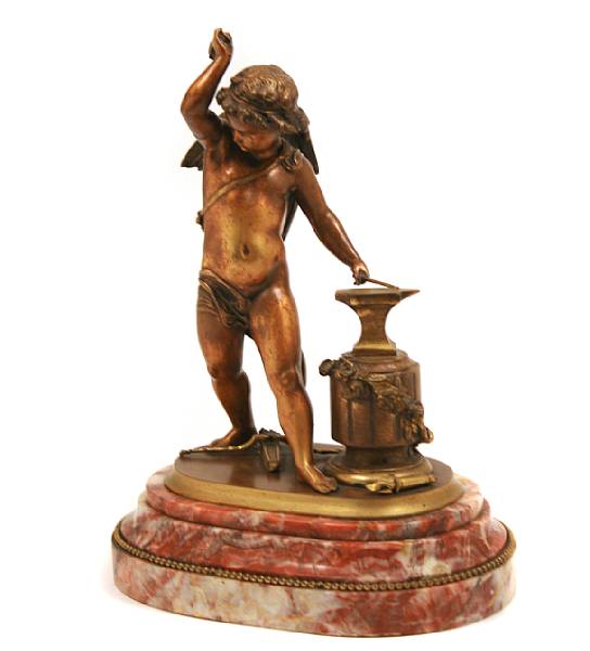 Appraisal: A French patinated bronze figure of Cupid at the Anvil