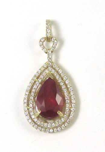 Appraisal: RUBY DIAMOND AND FOURTEEN KARAT GOLD PENDANT with round-cut diamonds