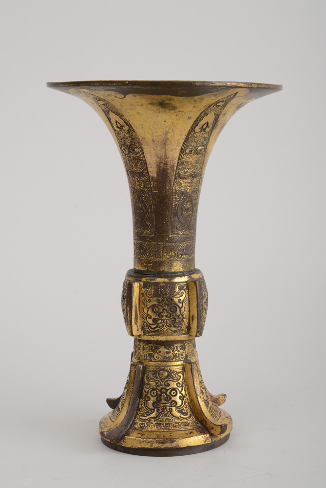 Appraisal: CHINESE ARCHAIC STYLE GOLD-WASHED BRONZE GU The flared beaker upper