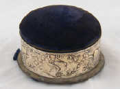 Appraisal: A silver mounted circular jewellery box with pincushion lid AF