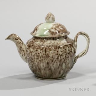 Appraisal: Tortoiseshell-glazed Cream-colored Earthenware Teapot and Cover England c double entwined