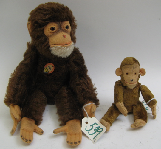 Appraisal: TWO GERMAN STEIFF MONKEYS The larger monkey with brown and