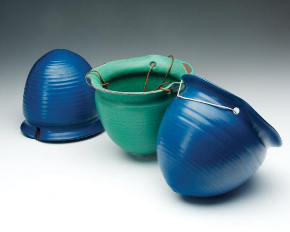 Appraisal: MARBLEHEAD Three hanging baskets covered in blue or green matte