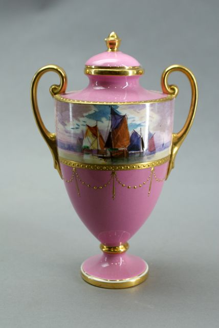 Appraisal: A Minton's urn and cover in pink with gilded accents