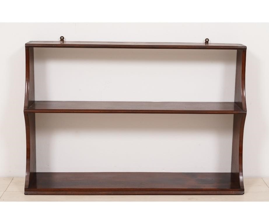 Appraisal: Mahogany hanging shelf th c with dovetail construction h x