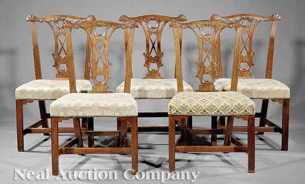 Appraisal: A Suite of Five Irish Carved Mahogany Dining Chairs in