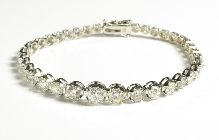 Appraisal: DIAMOND AND FOURTEEN KARAT GOLD TENNIS BRACELET with appraisal The