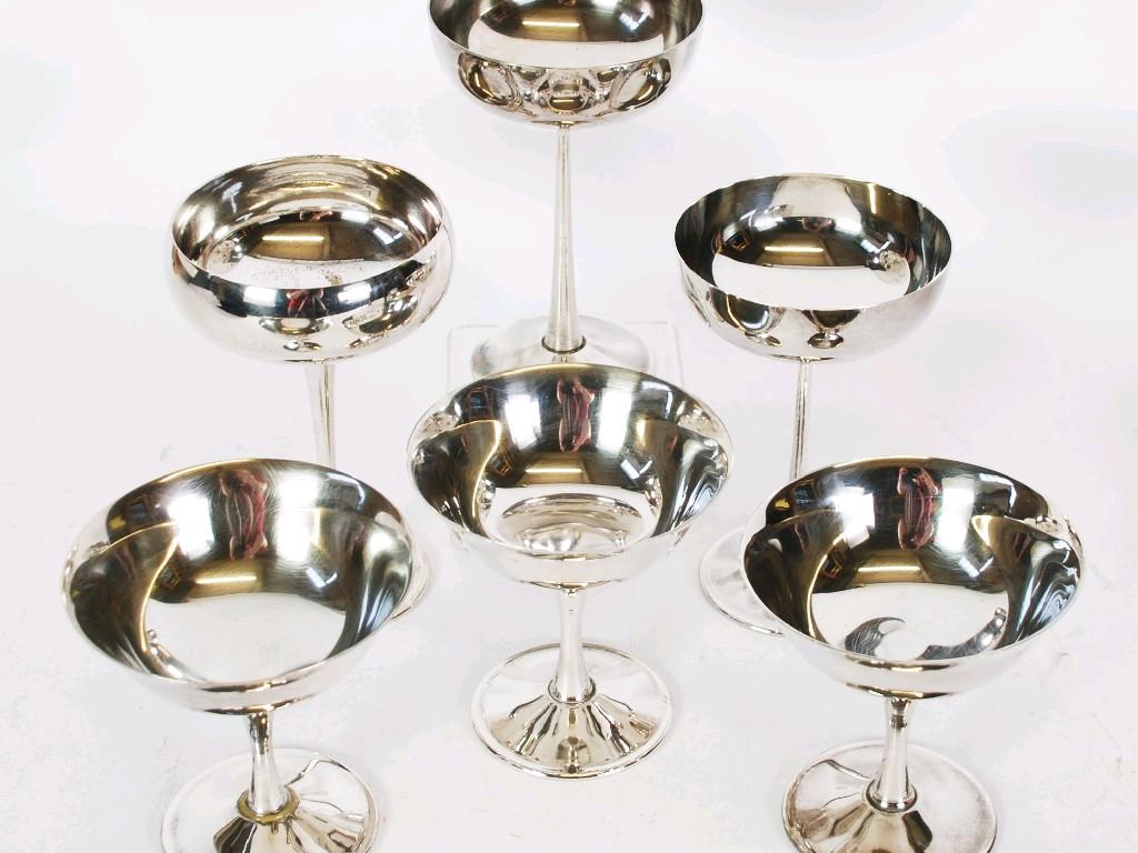 Appraisal: SET OF NINE ELECTRO PLATED SAUCER CHAMPAGNES AND THREE TALL