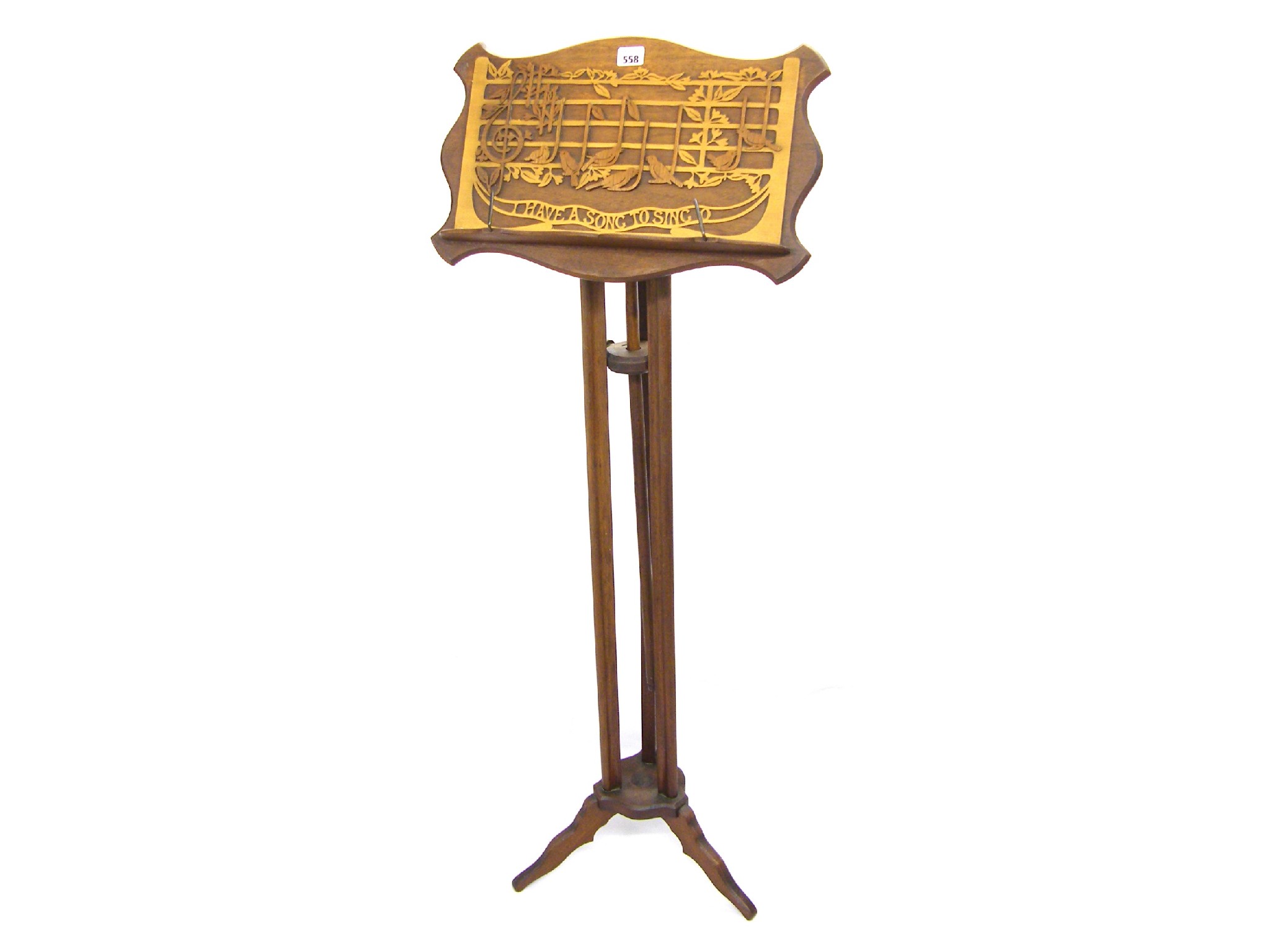 Appraisal: Mahogany music stand the wavy edged ledge with blind fret