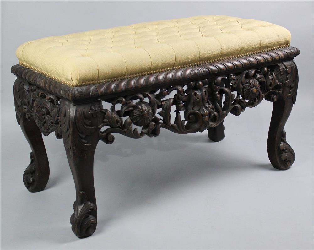 Appraisal: BAROQUE STYLE CARVED WALNUT BENCH with tufted upholstered seat over