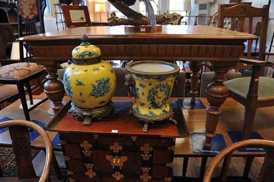 Appraisal: A FRENCH OAK DINING TABLE WITH TWO SPARE LEAVES