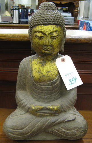 Appraisal: A GRANITE SCULPTURE depicting Gautama Buddha seated with crossed legs