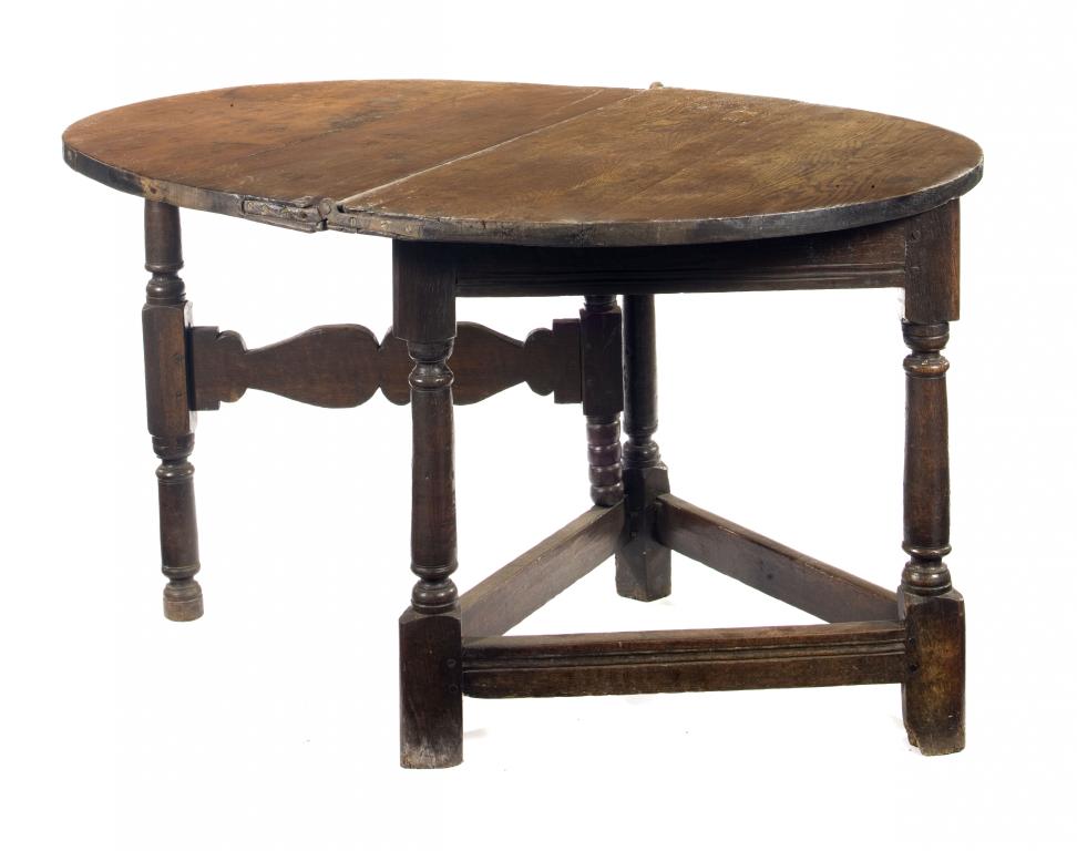 Appraisal: A CHARLES II JOINED OAK TABLE the semi-circular foldover top