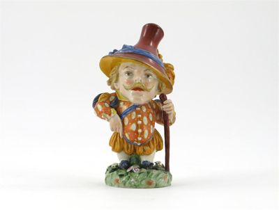 Appraisal: A Royal Worcester Mansion House dwarf holding a staff and