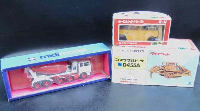 Appraisal: THREE DIECAST SCALE MODELS Gescha model Liebherr cement truck painted