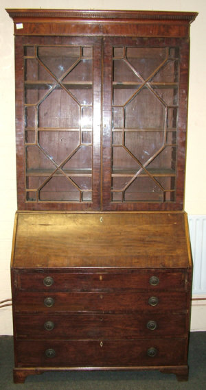 Appraisal: A Georgian mahogany bureau bookcase circa the dentil moulded cornice