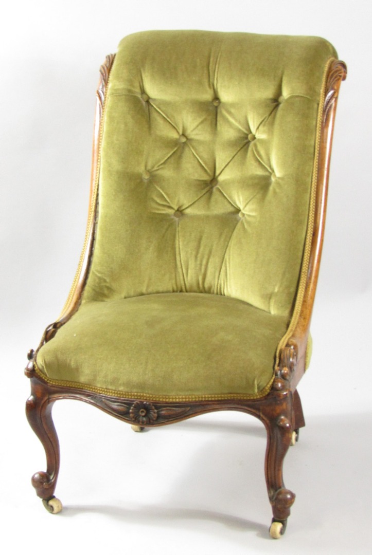 Appraisal: A Victorian mahogany nursing chair with leaf carving upholstered in