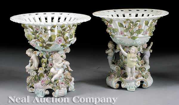 Appraisal: A Large Pair of Antique German Porcelain Corbeilles winged putti