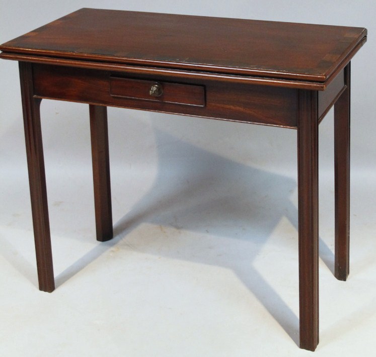 Appraisal: An early thC mahogany stained fold over tea table the