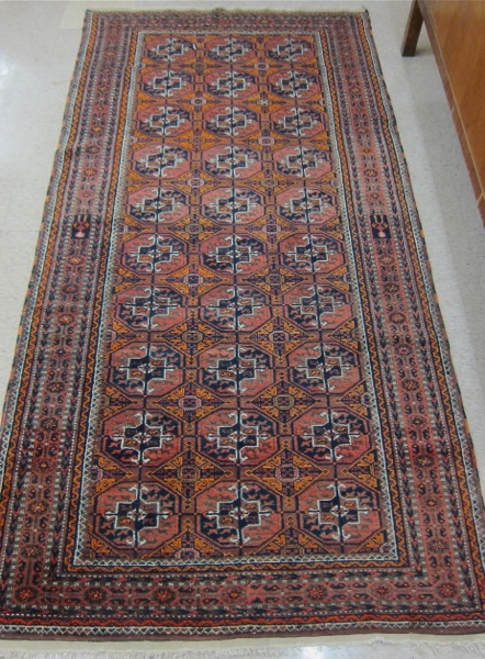 Appraisal: BELOUCH TURKOMAN AREA RUG hand knotted in an overall geometric