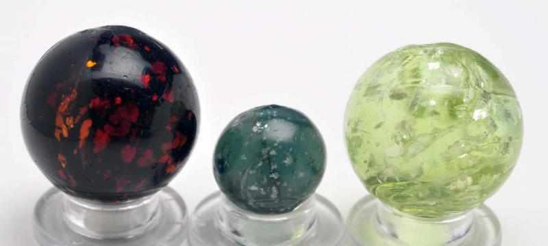 Appraisal: Lot of Mica Marbles Description Includes a dusky blue-green one