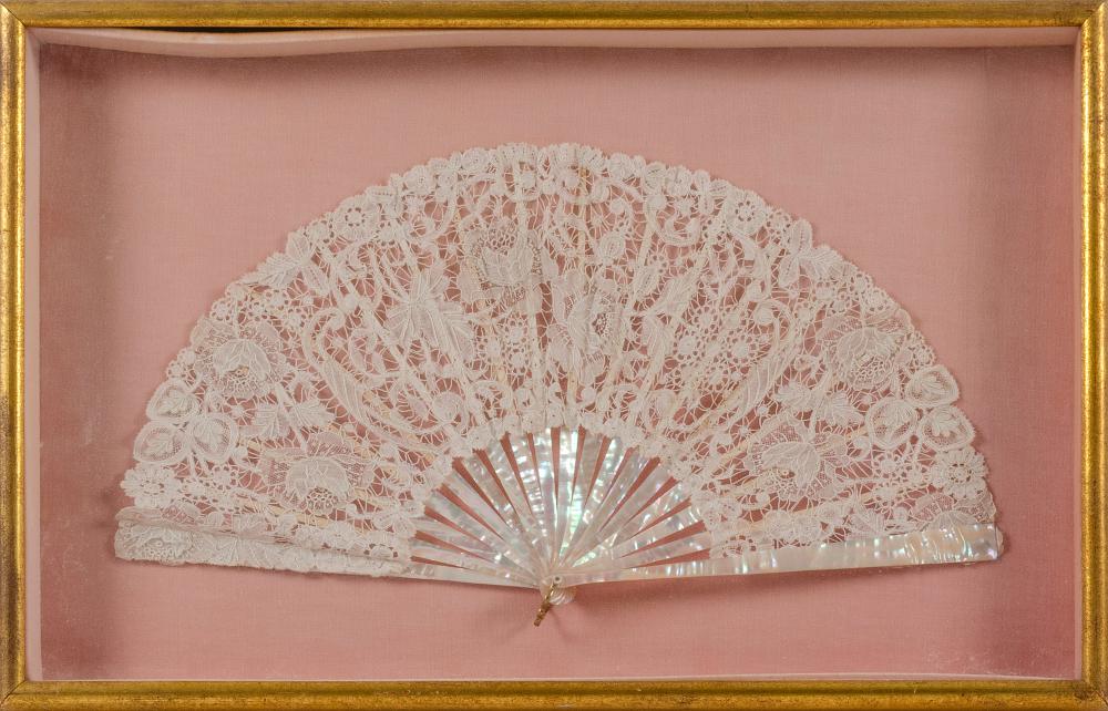 Appraisal: CASED LACE AND MOTHER-OF-PEARL FAN TH CENTURY LENGTH EXTENDED FRAMED