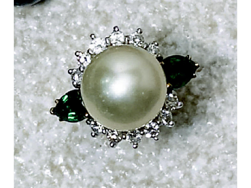 Appraisal: A SOUTH SEA PEARL EMERALD AND DIAMOND RING A South