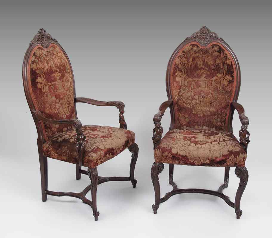 Appraisal: PAIR OF FIGURAL CARVED ARM CHAIRS Carved and molded open