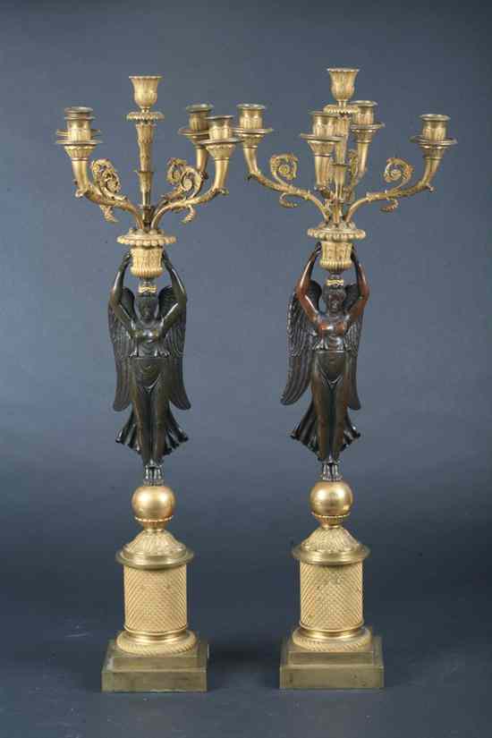 Appraisal: PAIR RESTAURATION ORMOLU AND BRONZE FIVE-LIGHT CANDELABRA Circa Columnar base