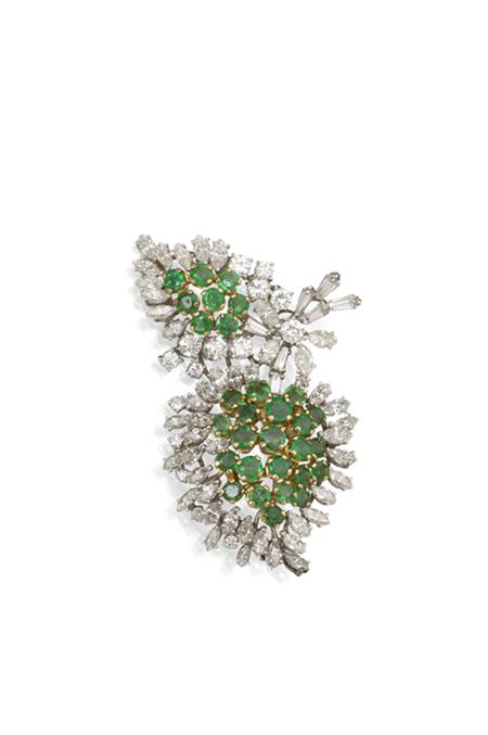 Appraisal: An emerald and diamond foliate spray brooch of asymmetric design