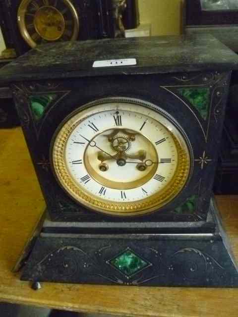 Appraisal: A VICTORIAN BLACK SLATE MANTEL CLOCK of stylised form with