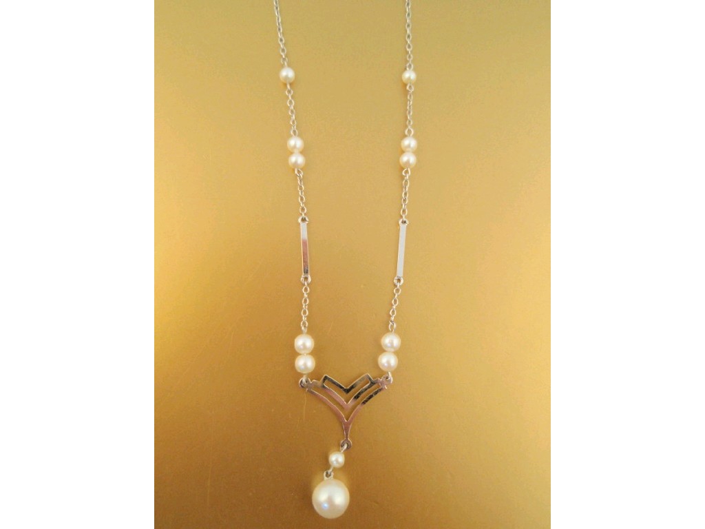 Appraisal: A white metal and pearl bead necklace stamped c