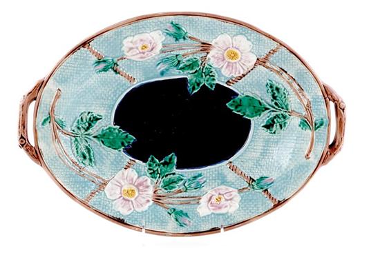 Appraisal: English majolica platter late th century oval floral-molded form flanked