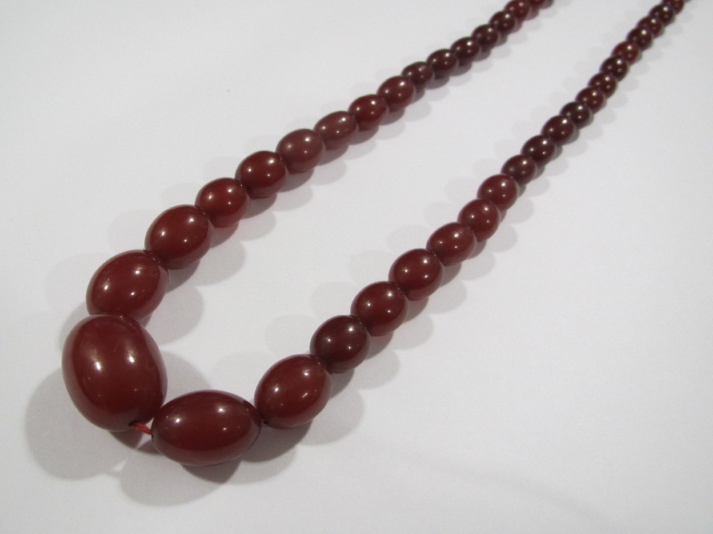 Appraisal: String of cherry amber beads Approximately inches