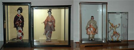 Appraisal: Group of Four Asian Dolls in Vitrines Estimate -