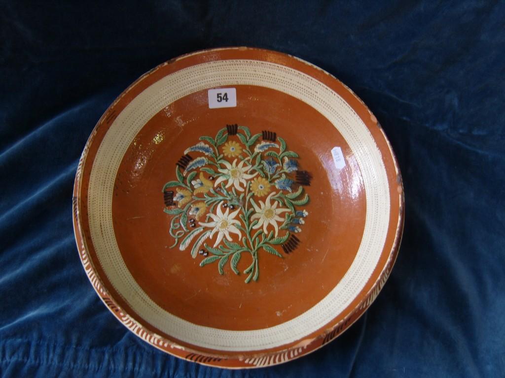 Appraisal: A continental earthenware dish probably Swiss with painted floral bouquet