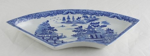 Appraisal: A Davenport crescent shaped supper dish transfer printed Willow pattern